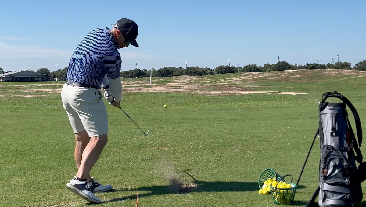 Golfer Geek & Mizuno Pro 245 9-iron after impact