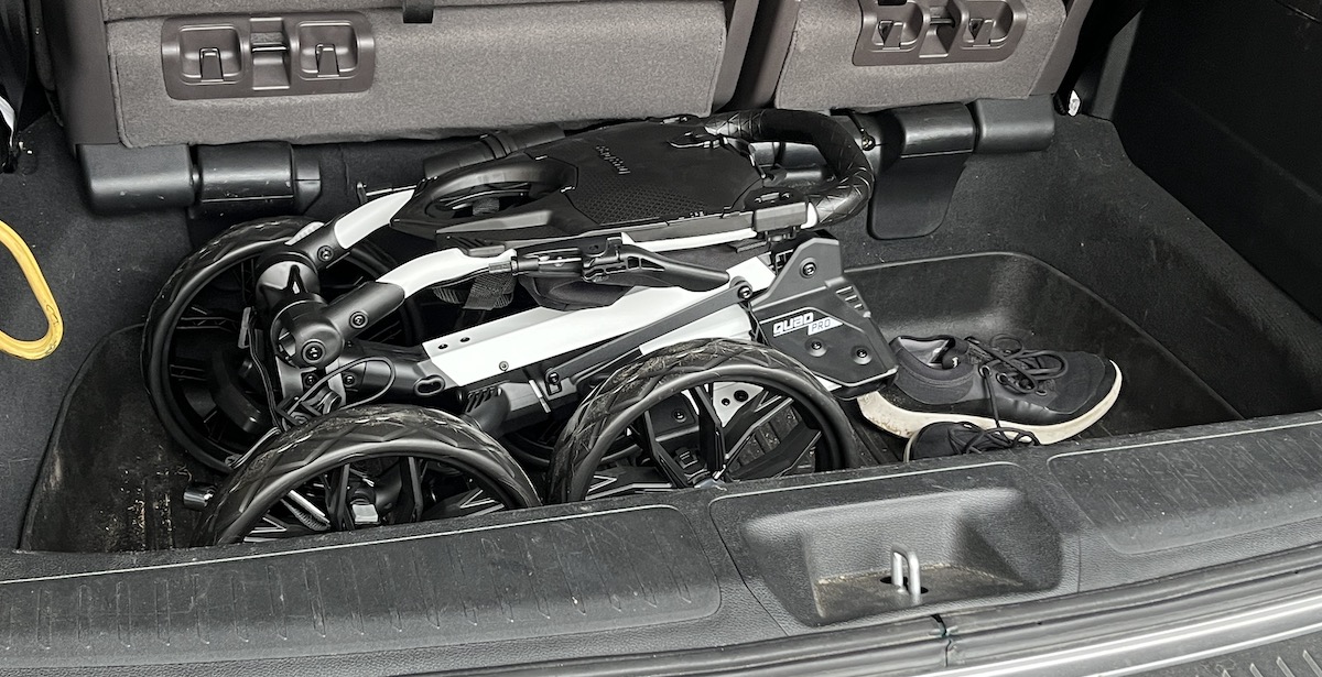 Bag Boy Quad Pro folded in a car trunk