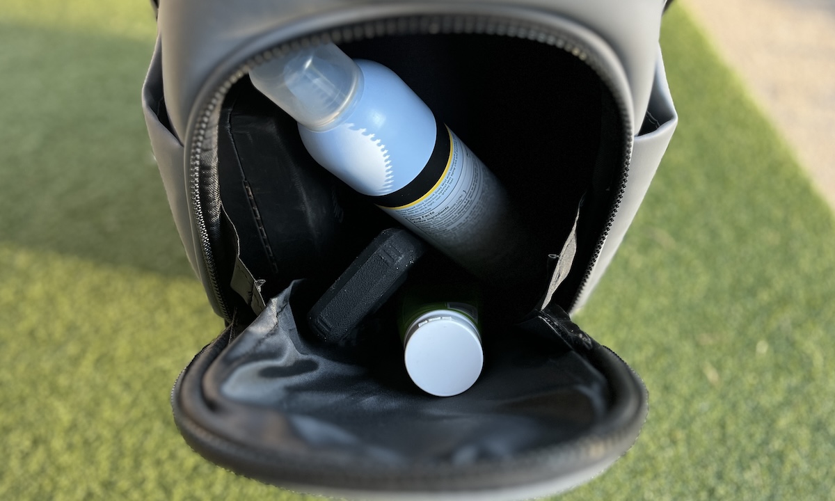 Stewart Golf Nexas Hybrid Stand Bag contents of large bottom pocket Stewart Golf Nexas Hybrid Stand Bag contents of large bottom pocket