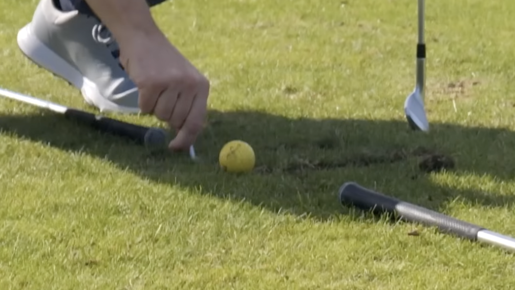Scratching your line with a tee for better ball contact