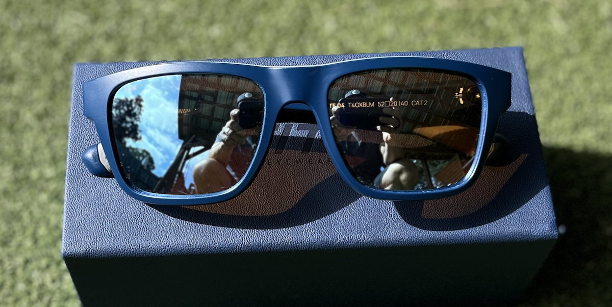 TITE 04 Blue Mirror golf sunglasses on their case
