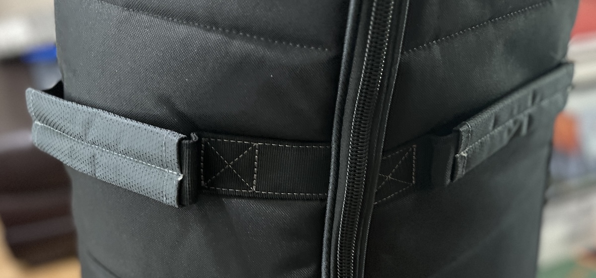 Reinforced grab handles and webbing on the Bag Boy Freestyle travel cover