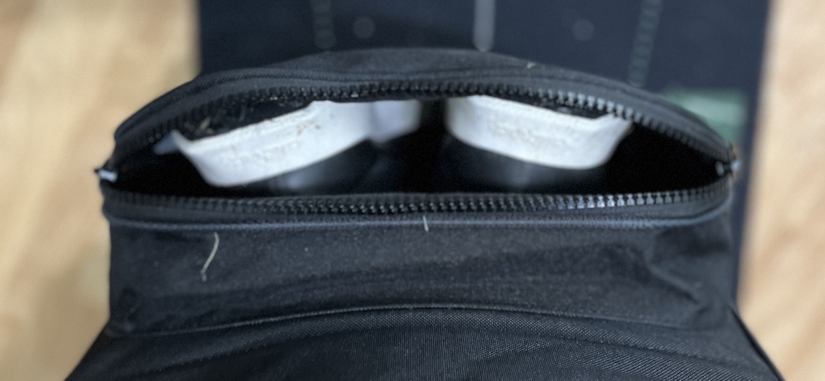 Golf shoes in the oversized exterior shoe compartment of the Bag Boy Freestyle travel cover