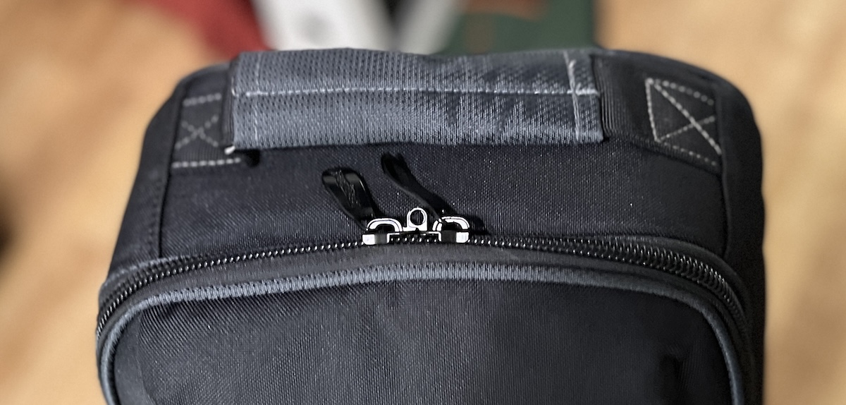 Lockable dual zipper pulls and top handle on the Bag Boy Freestyle travel cover