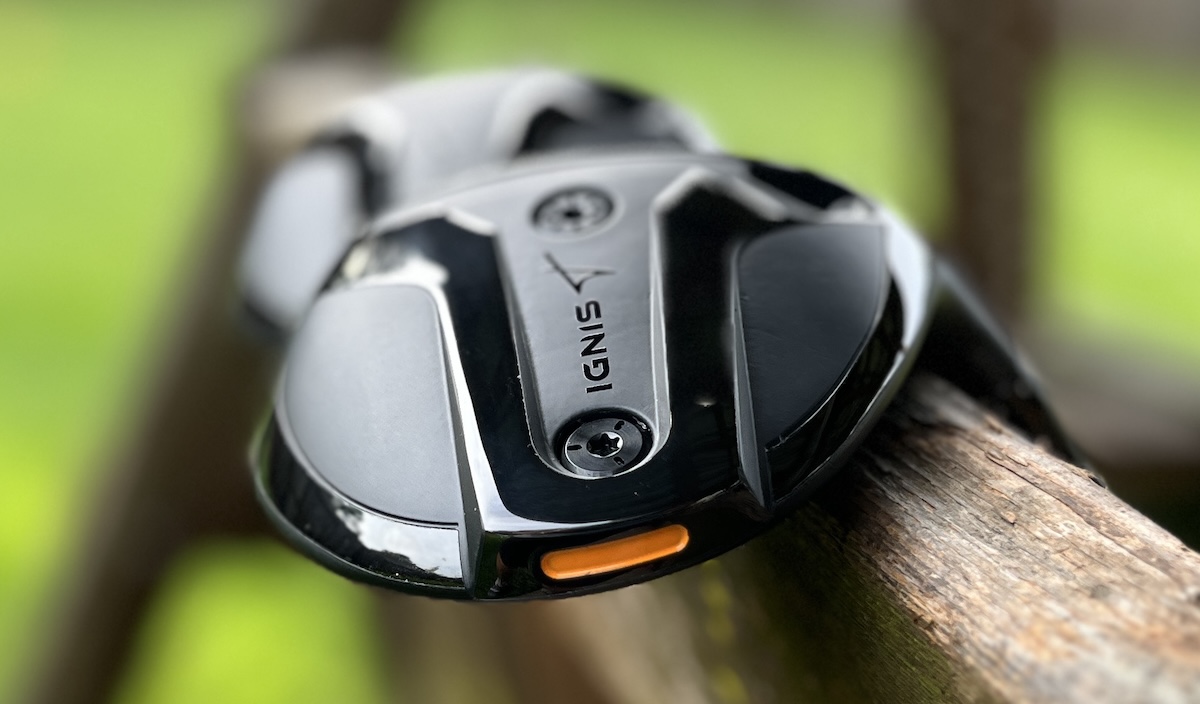 Sole of the Takomo Ignis D2 fairway wood, showing the IGNIS badge, weight ports and orange rear accent